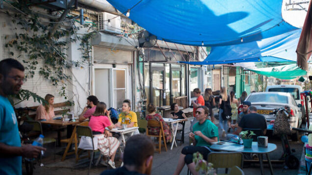 People enjoy sitting at a restaurant at the Carmel market. The restaurants will officially open tomorrow after being closed for weeks in an attempt to stop the spread of the Coronavirus. May 26, 2020. Photo by Miriam Alster/FLASH90 *** Local Caption *** ?? ????
??????
?????
????
??? ????? People enjoy sitting at a restaurant at the Carmel market. The restaurants will officially open tomorrow after being closed for weeks in an attempt to stop the spread of the Coronavirus. May 26, 2020. Photo by Miriam Alster/FLASH90 *** Local Caption *** ?? ????
??????
?????
????
??? ?????