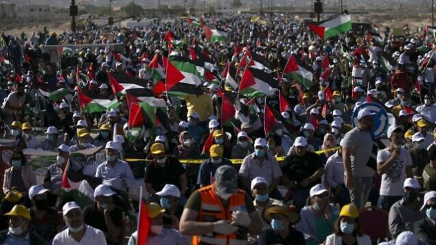 Palestinians participate in a big rally to protest against Israel's plan to annex parts of the occupied West Bank, in Jericho on June 22, 2020. (Photo by ABBAS MOMANI / AFP) Palestinians participate in a big rally to protest against Israel's plan to annex parts of the occupied West Bank, in Jericho on June 22, 2020. (Photo by ABBAS MOMANI / AFP)