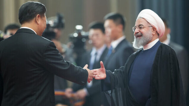Chinese President Xi Jinping, left, greets Iranian President Hassan Rouhani at the Shanghai Cooperation Organization (SCO) Summit in Qingdao in eastern China's Shandong Province, Sunday, June 10, 2018. China will seek to further promote its economic links with Central Asia during this weekend's summit of the China and Russia-dominated SCO. (AP Photo/Alexander Zemlianichenko) Chinese President Xi Jinping, left, greets Iranian President Hassan Rouhani at the Shanghai Cooperation Organization (SCO) Summit in Qingdao in eastern China's Shandong Province, Sunday, June 10, 2018. China will seek to further promote its economic links with Central Asia during this weekend's summit of the China and Russia-dominated SCO. (AP Photo/Alexander Zemlianichenko)