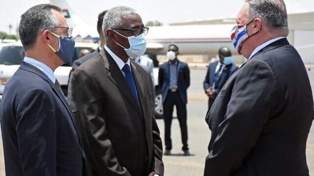 US Secretary of State Mike Pompeo (R) is welcomed by a Sudanese official in Khartoum on August 25, 2020. - Pompeo is on an official visit to Sudan to urge more Arab countries to normalise ties with Israel, following the US-brokered Israel-UAE agreement. He is the first American top diplomat to visit Sudan since Condoleezza Rice went in 2005. (Photo by - / AFP) US Secretary of State Mike Pompeo (R) is welcomed by a Sudanese official in Khartoum on August 25, 2020. - Pompeo is on an official visit to Sudan to urge more Arab countries to normalise ties with Israel, following the US-brokered Israel-UAE agreement. He is the first American top diplomat to visit Sudan since Condoleezza Rice went in 2005. (Photo by - / AFP)