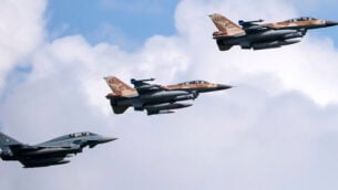 A German air force Bundeswehr Eurofighter and an Israeli Air Force F-16 jets fly in formation over the Fuerstenfeldbruck airbase in commemoration of the 1972 Olympic Games assassination attempt in Fuerstenfeldbruck, Germany, Tuesday, Aug. 18, 2020. The attempt to rescue the hostages failed at the airbase in Fuerstenfeldbruck in 1972and the hostages perished. It is the Israeli Air Force's first time conducting joint air combat exercises in Germany. (Sven Hoppe/dpa via AP)