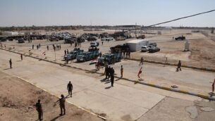Iraqi security forces prepare to open the crossing between the Iraqi town of Qaim and Syria's Boukamal, in Qaim, Iraq, Monday, Sept. 30, 2019. Iraq and Syria opened Monday a key border crossing between the two neighboring countries, seven years after it was closed during Syria's civil war and the battle against the Islamic State group. (AP Photo/Hadi Mizban)