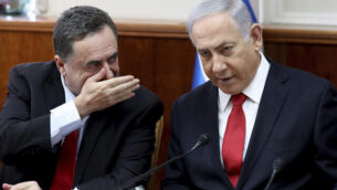 Israeli Prime Minister Benjamin Netanyahu, right, listens to Foreign Minister Israel Katz during the weekly cabinet meeting at his office in Jerusalem, Sunday, Oct. 27, 2019.  Israel's prime minister says he wants a "broad national unity government" amid political deadlock over forming a government following last month's elections. Speaking to his Cabinet, Benjamin Netanyahu said such a coalition is essential for Israel to face what he said were mounting security challenges around the region. (Gali Tibbon/Pool Photo via AP)