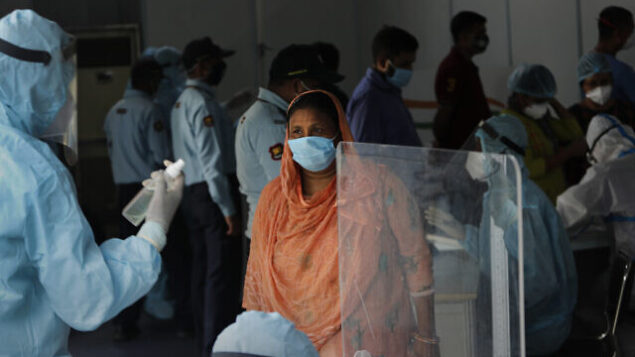 Indian health volunteers register people participating in the India-Israel Non-Invasive Raid COVID-19 test study camp, at a government hospital in New Delhi, India, Friday, July 31, 2020. A team of Israeli scientists are in the country to carry out the final stages of testing of advanced technologies for real time rapid diagnosis of the coronavirus. (AP Photo/Manish Swarup) Indian health volunteers register people participating in the India-Israel Non-Invasive Raid COVID-19 test study camp, at a government hospital in New Delhi, India, Friday, July 31, 2020. A team of Israeli scientists are in the country to carry out the final stages of testing of advanced technologies for real time rapid diagnosis of the coronavirus. (AP Photo/Manish Swarup)