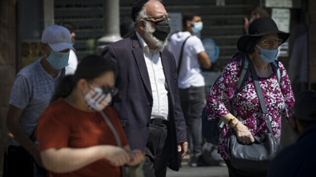 Jerusalemites wearing face masks for fear of coronavirus walk on Jaffa road in the City Center of Jerusalem on July on August 02, 2020. Israel has seen a spike of new COVID-19 cases, cabinet ministers imposed new restrictions on public gatherings in a bid to stem the rising infection rate of the coronavirus.
Photo by Olivier Fitoussi/Flash90 *** Local Caption *** ירושלים
קורונה
וירוס
יפו
מירכז העיר Jerusalemites wearing face masks for fear of coronavirus walk on Jaffa road in the City Center of Jerusalem on July on August 02, 2020. Israel has seen a spike of new COVID-19 cases, cabinet ministers imposed new restrictions on public gatherings in a bid to stem the rising infection rate of the coronavirus.
Photo by Olivier Fitoussi/Flash90 *** Local Caption *** ירושלים
קורונה
וירוס
יפו
מירכז העיר
