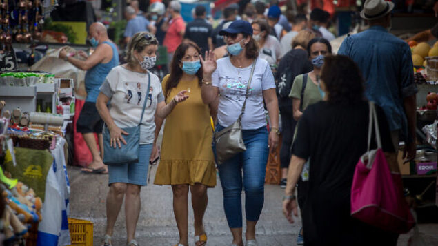 Israelis wear protective face masks as they shop for food at the Carmel market in Tel Aviv on August 05, 2020. Photo by Miriam Alster/FLASh90 *** Local Caption *** שוק הכרמל
תל אביב
קורונה
קניות
מסיכה
מסיכות Israelis wear protective face masks as they shop for food at the Carmel market in Tel Aviv on August 05, 2020. Photo by Miriam Alster/FLASh90 *** Local Caption *** שוק הכרמל
תל אביב
קורונה
קניות
מסיכה
מסיכות
