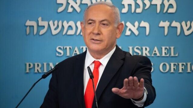 Israeli Prime Minister Benjamin Netanyahu gives a briefing on coronavirus developments in Israel at his office in Jerusalem, on September 13, 2020. - Israel's government announced it would impose a three-week nationwide lockdown in an effort to stem one of the world's highest novel coronavirus infection rates after a surge in cases. (Photo by Yoav Dudkevitch / POOL / AFP) Israeli Prime Minister Benjamin Netanyahu gives a briefing on coronavirus developments in Israel at his office in Jerusalem, on September 13, 2020. - Israel's government announced it would impose a three-week nationwide lockdown in an effort to stem one of the world's highest novel coronavirus infection rates after a surge in cases. (Photo by Yoav Dudkevitch / POOL / AFP)