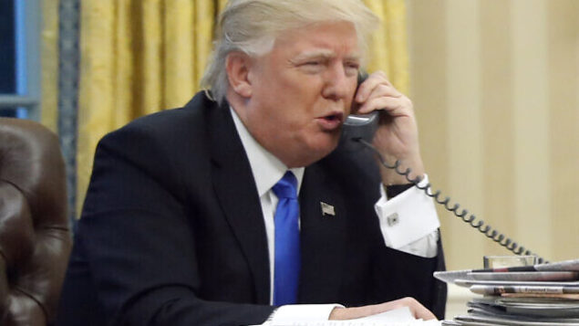 FILE - In this Jan. 28, 2017, file photo, President Donald Trump speaks on the phone with Prime Minister of Australia Malcolm Turnbull in the Oval Office of the White House in Washington. Trump, who blasted Hillary Clinton for using a personal email server, might be a walking magnet for eavesdropping and malware if he is using an unsecured cellphone to chat with foreign leaders. Trump has been handing out his cellphone number to counterparts around the world, urging them to call him directly to avoid the red tape of diplomatic communications. The practice has raised concern about the security and secrecy of the U.S. commander-in-chief's communications. (AP Photo/Alex Brandon, File) FILE - In this Jan. 28, 2017, file photo, President Donald Trump speaks on the phone with Prime Minister of Australia Malcolm Turnbull in the Oval Office of the White House in Washington. Trump, who blasted Hillary Clinton for using a personal email server, might be a walking magnet for eavesdropping and malware if he is using an unsecured cellphone to chat with foreign leaders. Trump has been handing out his cellphone number to counterparts around the world, urging them to call him directly to avoid the red tape of diplomatic communications. The practice has raised concern about the security and secrecy of the U.S. commander-in-chief's communications. (AP Photo/Alex Brandon, File)