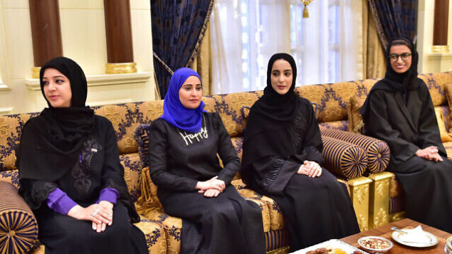 In this Feb. 14, 2016 image released by the Emirates News Agency, WAM, and made available today, from left to right, Reem Ibrahim Al Hashimi, UAE Minister of State for International Cooperation, Ohood Al Roumi appointed as Minister of State for Happiness, Shamma Al Mazrui appointed as Minister of State for Youth and Noura Al Kaabi, UAE Minister of State for FNC Affairs, take part at swearing-in ceremony for ministers in Abu Dhabi, United Arab Emirates. (WAM via AP)
