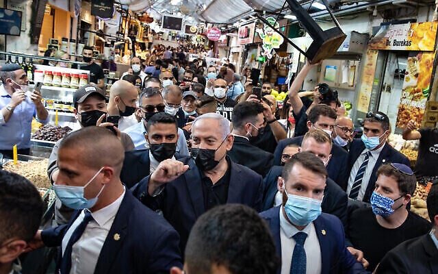 Israeli Prime Minister and head of the Likud party Benjamin Netanyahu visits at the Jerusalem Mahane Yehuda market, a day before the elections, on March 22, 2021. Photo by Olivier Fitoussi/Flash90 *** Local Caption