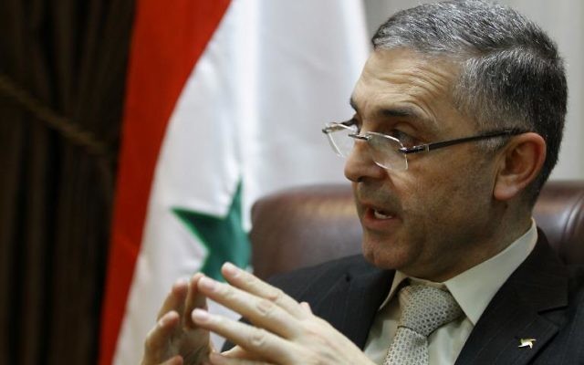 Le ministre syrien de la Réconciliation nationale, Ali Haidar, à Damas le 11 février 2014 (Crédit : AFP/Louai Beshara)