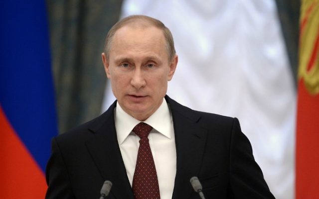 Le président russe Vladimir Poutine prononce un discours lors d'une cérémonie au Kremlin, le 25 mars 2014 (Crédit : Alexei Nikolsky/AFP Photo/Ria Novosti/POOL) Le président russe Vladimir Poutine prononce un discours lors d'une cérémonie au Kremlin, le 25 mars 2014 (Crédit : Alexei Nikolsky/AFP Photo/Ria Novosti/POOL)