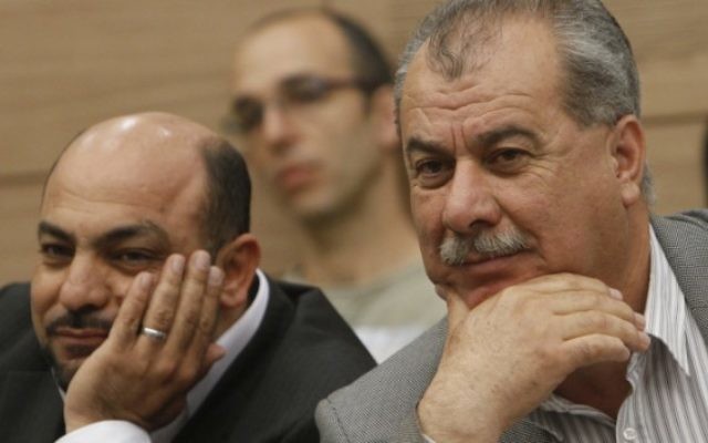 Le leader du parti Hadash, Mohammed Barakeh (à droite) et le député du parti Ra’am Ta’al Masoud Ganaim en 2012. (Crédit : Miriam Alster/Flash90)