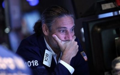 Un trader à la Bourse de New York (NYSE) le 24 août 2015 (Crédit photo: Spencer Platt / Getty Images / AFP)