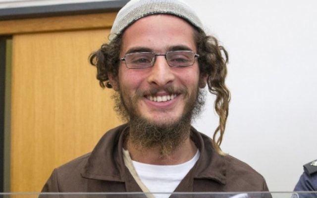Meir Ettinger, dirigeant d'un groupe extrémiste juif, devant la cour de justice israélienne à Nazareth Illit le 4 août 2015. (Crédit : Jack Guez/AFP) Meir Ettinger, dirigeant d'un groupe extrémiste juif, devant la cour de justice israélienne à Nazareth Illit le 4 août 2015. (Crédit : Jack Guez/AFP)