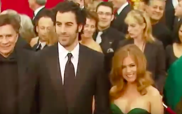 Sacha Baron Cohen et Isla Fisher (Crédit : capture d'écran YouTube)