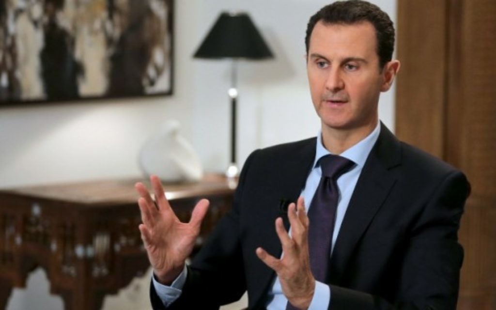 Le président syrien Bashar el-Assad, dans son bureau à Damas, le 12 février 2016.(Crédit : Joseph Eid/AFP) Le président syrien Bashar el-Assad, dans son bureau à Damas, le 12 février 2016.(Crédit : Joseph Eid/AFP)