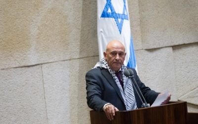 Basel Ghattas, député de la Liste arabe unie, s'adresse à la Knesset, le 26 novembre 2014. (Crédit : Miriam Alster/Flash90)