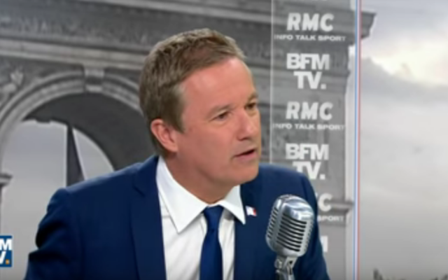 Le candidat à l'élection présidentielle, Nicolas Dupont-Aignan, sur BFMTV le 14 avril 2017 (Crédit : Capture d'écran YouTube) Le candidat à l'élection présidentielle, Nicolas Dupont-Aignan, sur BFMTV le 14 avril 2017 (Crédit : Capture d'écran YouTube)