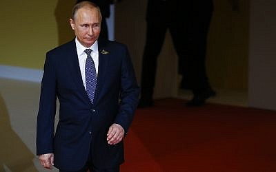 Le président russe Vladimir Poutine arrive au premier jour du sommet économique du G20 le 7 juillet 2017 à Hambourg en Allemagne (Crédit : Morris MacMatzen / Getty Images via JTA)