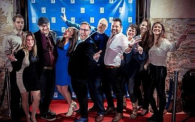 Le fondateur Adam Bellos, cinquième à partir de la gauche, et les membres de l'équipe du Fonds d'innovation israélien à la soirée de lancement de "Wine on the Vine" le 18 janvier 2018 à Jaffa. (Aviram Valdman)