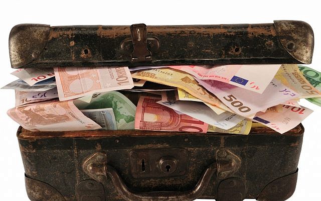 Illustration d'une valise remplie d'argent (ungorf; iStock by Getty Images) Illustration d'une valise remplie d'argent (ungorf; iStock by Getty Images)