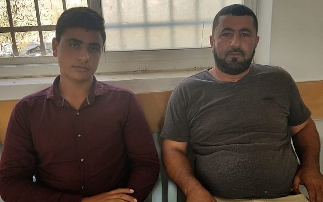 Yahya et Khaled Yousef, des membres de la famille de Mohammed Yousef, qui a poignardé trois Israéliens, tuant l'un d'eux. Photo prise dans le village de Kobar, en Cisjordanie, le 29 juillet 2018 (Crédit : Adam Rasgon/Times of Israel) Yahya et Khaled Yousef, des membres de la famille de Mohammed Yousef, qui a poignardé trois Israéliens, tuant l'un d'eux. Photo prise dans le village de Kobar, en Cisjordanie, le 29 juillet 2018 (Crédit : Adam Rasgon/Times of Israel)