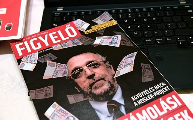 La couverture d'un magasine hongrois 'Figyelo' (Attention) montre Andras Heisler, hchef de la fédération des communautés juives hongrois, entouré de billets de banque, le 30 novembre 2018. (Crédit : ATTILA KISBENEDEK / AFP)
