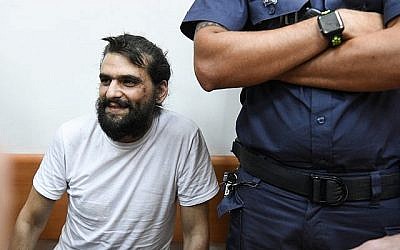 Le fondateur de Telegrass, Amos Dov Silver, comparaît devant le tribunal de première instance de Rishon Lezion pour une audience provisoire le 18 août 2019, après avoir été extradé d'Ukraine vers Israël. (Crédit : Avi Dishi / Flash90) Le fondateur de Telegrass, Amos Dov Silver, comparaît devant le tribunal de première instance de Rishon Lezion pour une audience provisoire le 18 août 2019, après avoir été extradé d'Ukraine vers Israël. (Crédit : Avi Dishi / Flash90)