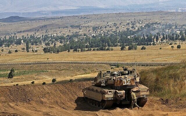 Un char Merkava israélien prend position à la frontière entre Israël et la Syrie, sur le plateau du Golan, le 20 juillet 2018. (AFP Photo/Jalaa Marey) Un char Merkava israélien prend position à la frontière entre Israël et la Syrie, sur le plateau du Golan, le 20 juillet 2018. (AFP Photo/Jalaa Marey)
