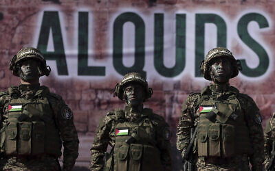 Palestinian members of the Qassam brigades, the militia wing of Hamas movement, attend a rally marking the 30th anniversary of their group, in Gaza City, Thursday, Dec. 14, 2017. (AP Photo/ Khalil Hamra)