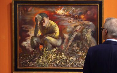 Un homme regarde la peinture "Caïn ou Hitler en enfer", de George Grosz, au Musée historique allemand de Berlin, le 4 février 2020. (Crédit : AP Photo / Jens Meyer)