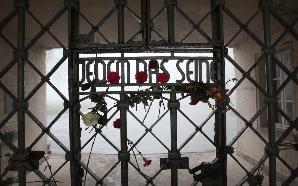 The front gate at Buchenwald whose inscription reads, 'To Each What He Deserves.' (Photo credit: courtesy of Paul Paul Pugliese)