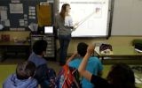 A teacher uses a touch-screen 'smart board' in a Jerusalem classroom. (photo credit: Kobi Gideon/Flash90)