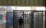 A Palestinian man walks through the Qalandiya checkpoint, April 30 (photo credit: Elhanan Miller/Times of Israel)