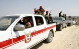 Forces de sécurité palestiniennes inspectent le siège de sécurité détruit lors des combats entre le Hamas et Israël sur la frontière entre l'Egypte et la bande de Gaza à Rafah - 31 août 2014. (Crédit : Abed Rahim Khatib / Flash90)