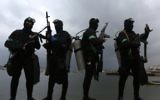 Les plongeurs des Brigades Ezzedine al-Qassam, la branche armée du Hamas, pendant une cérémonie marquant le 27e anniversaire de la création du mouvement terroriste, à Gaza Ville, le 14 décembre 2014. (Crédit : Mahmud Hams/AFP)