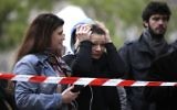Photo d'illustration : Une femme pleure devant le Bataclan après les attentats de Paris du 13 novembre 2015  (Crédit : AFP)