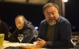 L'artiste chinois Ai Weiwei avec son équipe à l'hôtel Al-Roots, à Gaza ville, le 11 mai 2016. (Crédit : Mahmud Hams/AFP)