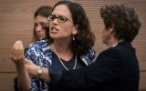 La députée Rachel Azaria (Koulanou) est expulsée de la séance de la commission  des Affaires intérieures consacrée à une proposition de loi pour modifier les règlements de l'utilisation des bains rituels, le 6 juin 2016. (Crédit : Hadas Parush/Flash90)