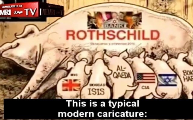 Un reportage de la Première chaîne russe présente une bande dessinée antisémite décrivant une truie marquée d'une étoile de David et du mot « Rothschild » allaitant six porcelets (avec les mots MI6, ISIS, Al-Qaïda, CIA, Israël et Boko Haram écrits sur eux) comme une « caricature moderne et typique » (Crédit : Capture d'écran/MEMRI-TV) Un reportage de la Première chaîne russe présente une bande dessinée antisémite décrivant une truie marquée d'une étoile de David et du mot « Rothschild » allaitant six porcelets (avec les mots MI6, ISIS, Al-Qaïda, CIA, Israël et Boko Haram écrits sur eux) comme une « caricature moderne et typique » (Crédit : Capture d'écran/MEMRI-TV)