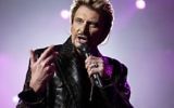 Johnny Hallyday, le 15 décembre 2003 sur scène à Paris. (Crédit : AFP /ARCHIVES / BERTRAND GUAY)