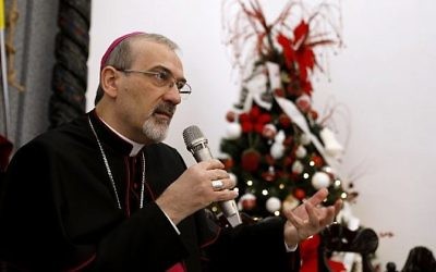 L'archevêque Pierbattista Pizzaballa, administrateur apostolique du Patriarcat latin durant une conférence de presse dans les locaux du Patriarcat, dans la Vieille Ville de Jérusalem, le 20 décembre 2017. (Crédit : AFP / GALI TIBBON)