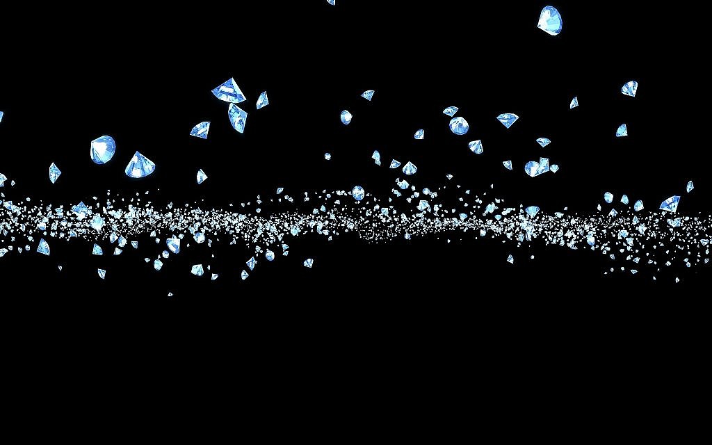 Particules de diamant sur un fond noir (Crédit : iStock)