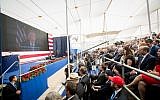 Le public écoute l'allocution pré-enregistrée de Donald Trump durant l'inauguration de l'ambassade américaine à Jérusalem, le 14 mai 2018 (Crédit : Yonatan Sindel/Flash90)