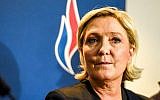 La dirigeante du Front national (aujourd'hui Rassemblement National) Marine Le Pen assistant au congrès annuel du parti d'extrême droite dans la ville française de Lille, le 10 mars 2018. (Crédit : Philippe Huguen/AFP)