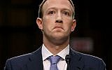 Le co-fondateur de Facebook, le PDG Mark Zuckerberg, est parti après avoir témoigné devant le comité sénatorial de la magistrature et du commerce dans l'immeuble de bureaux du Sénat à Capitol Hill, le 10 avril 2018, à Washington.  (Crédit : Chip Somodevilla/Getty Images/AFP)