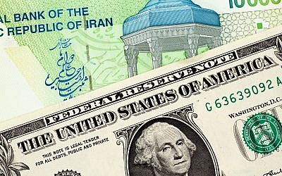 Un billet de banque iranien et un dollar américain. (Crédit : iStock)