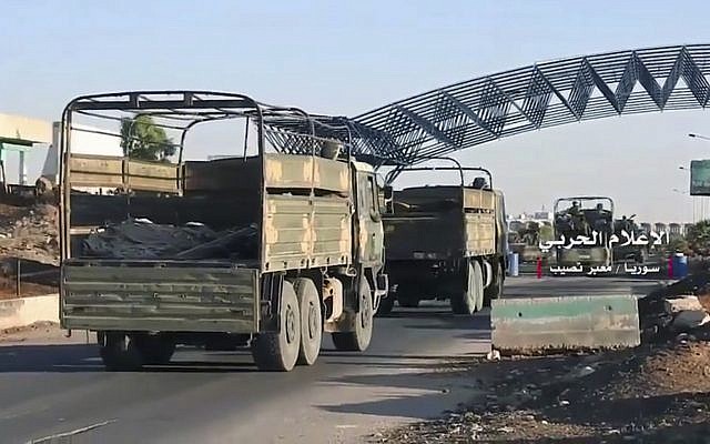 Convoy of Syrian military vehicles at Naseeb border crossing with Jordan, in the southern province of Daraa, Syria, July 7, 2018. (Syrian Central Military Media, via AP) Convoy of Syrian military vehicles at Naseeb border crossing with Jordan, in the southern province of Daraa, Syria, July 7, 2018. (Syrian Central Military Media, via AP)
