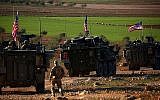 Des véhicules blindés des forces américaines circulent près du village de Yalanli, à la périphérie ouest de la ville de Manbij, au nord de la Syrie, le 5 mars 2017. (DELIL SOULEIMAN/AFP)